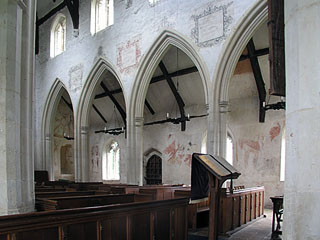 the nave arcade and  painted N aisle beyond