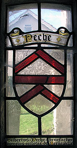 a window in the porch which contains a record of a benefactor to the Priory