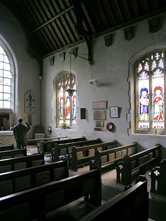 the gloomy interior - despiute the huge window where the chancel arch is
