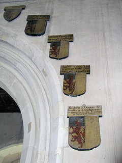 some shields round the tower arch