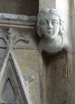 one of the charming carvings at the side of the east window